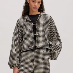 Zwart-crÃ¨me geblokte blouse met strikjes lisanne